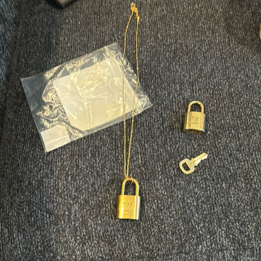 Authentic Louis Vuitton 2 gold locks and one key